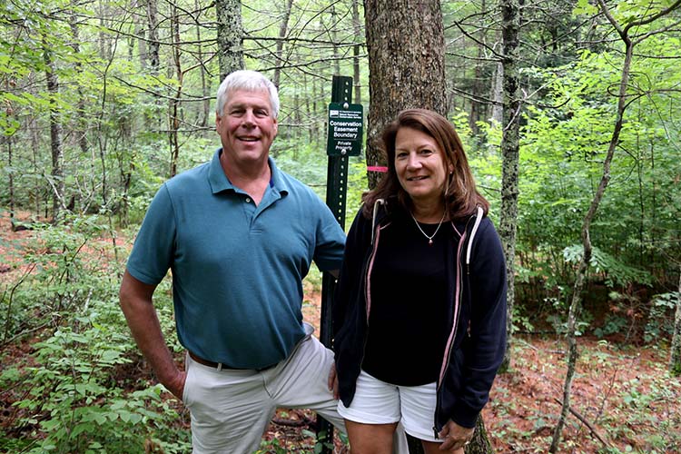Patrick and Diane Luther on their property in July 2019.
