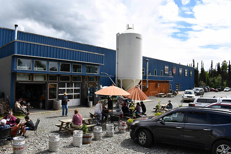 Customers enjoy cold beers on a summer day at Denali Brewing Company in Talkeetna, Alaska. Photo by Tracy Robillard, NRCS.