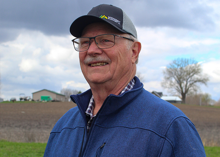 Person wearing cap and glasses