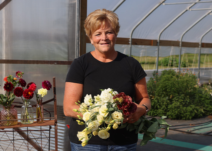 Person holding flower bouquet