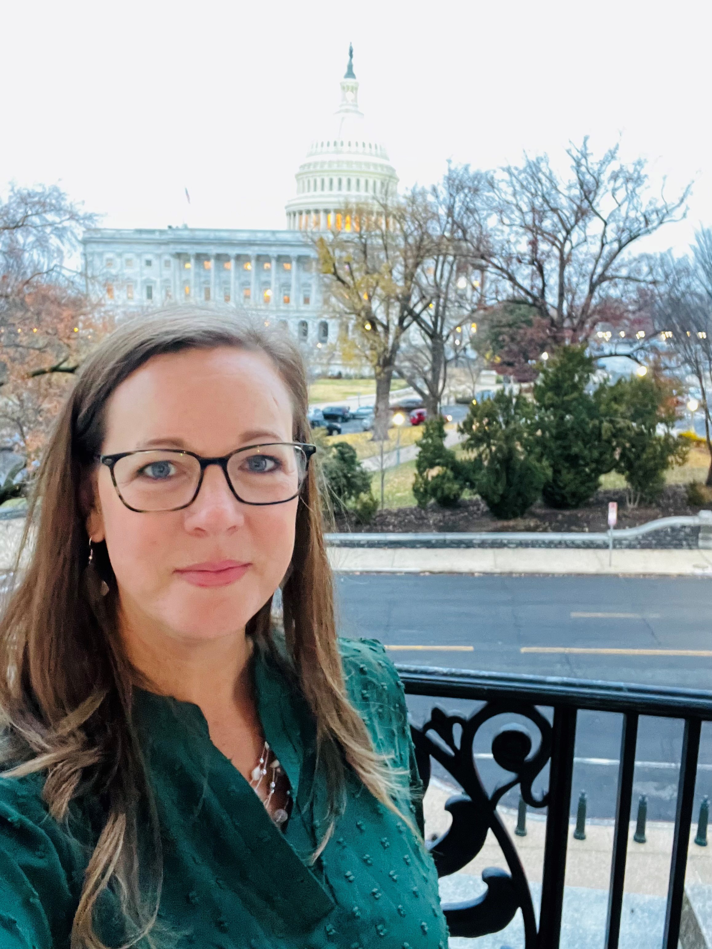 Person standing in front the U.S. Capitol buiding