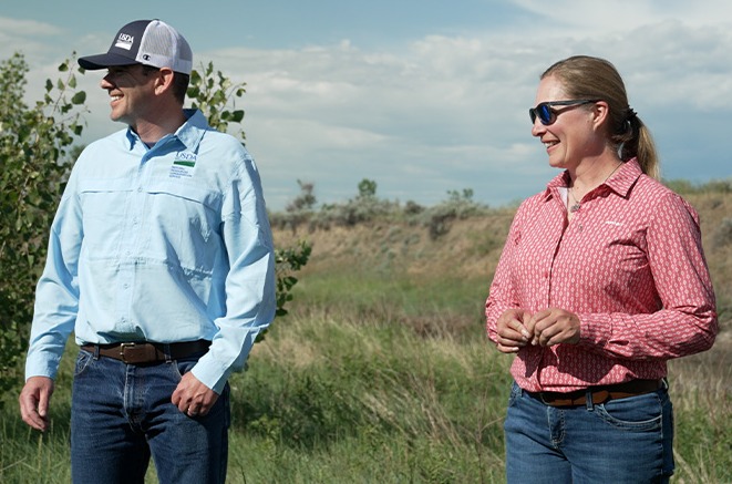 Two people on prairie land