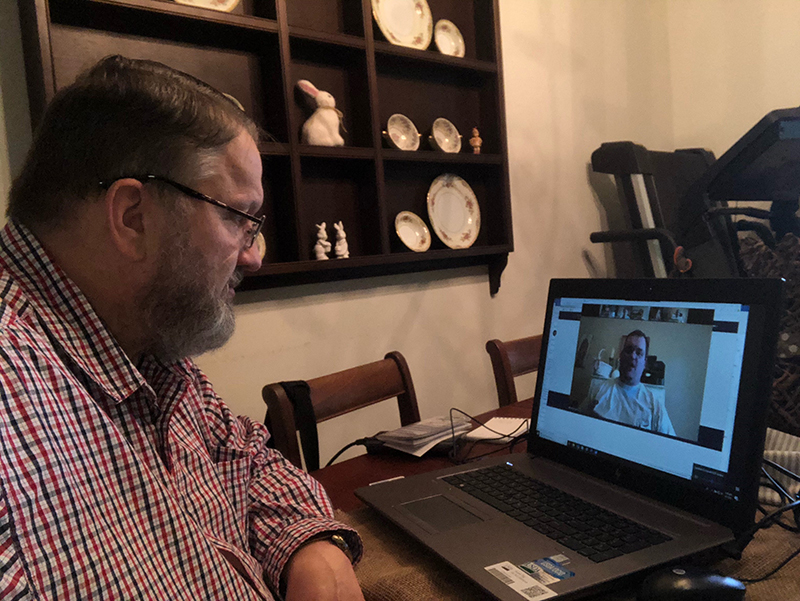 Tim Albritton using Zoom to conduct meeting