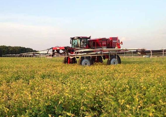 Farming equipment on a beautiful large field