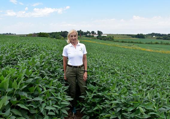 Maggie McQuown in a soybean field on her family’s Century Farm in Iowa. 