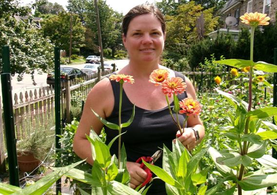 Person standing amongst flowers